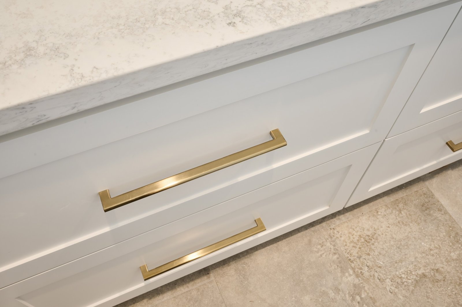 A close-up of brushed cabinet door handles